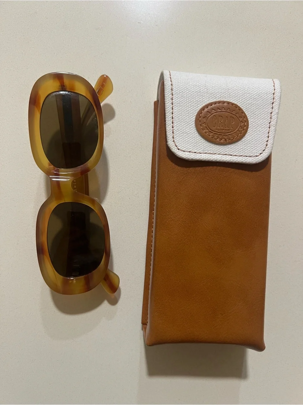 Crap Eyewear Tortoiseshell Oval Sunglasses with Brown & Cream Case